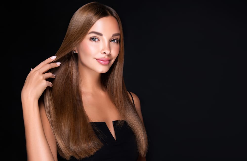 Woman with long smooth hair after keratin smoothing at Honeys Hair & Beauty in Taunton