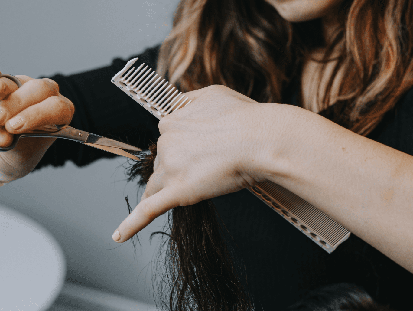 Professional haircut and blow-dry in progress at Honeys Hair & Beauty, Taunton, showing expert precision and styling for beautifully finished hair.