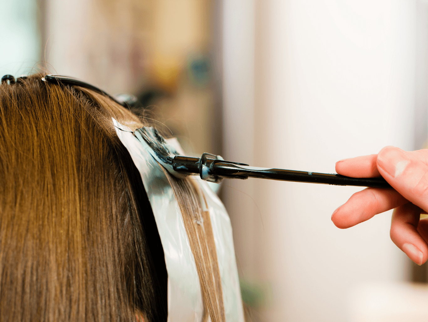 Hairdresser applying T-section foil highlights for a fresh, dimensional look at Honeys Hair & Beauty in Taunton.