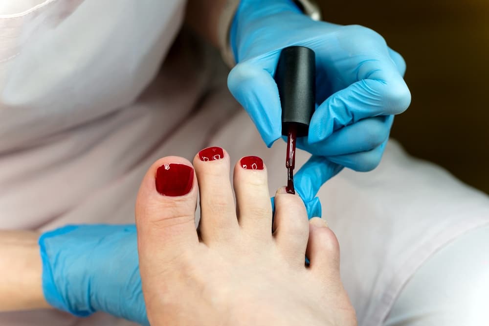 Professional toenail overlays with deep red polish at Honeys Hair & Beauty Taunton